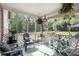 Relaxing screened porch with green views and comfortable furniture at 3510 Spring Valley Blvd, Atlanta, GA 30349