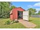 Spacious backyard shed with ramp access, offering ample storage and potential for various hobbies or projects at 3510 Spring Valley Blvd, Atlanta, GA 30349