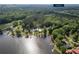 An aerial view shows the property at 48 Paschal Rd, Temple, GA near a scenic lake at 48 Paschal St, Temple, GA 30179