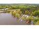 Picturesque aerial view of charming lakefront homes, showcasing private docks and the serene beauty of lakeside living at 48 Paschal St, Temple, GA 30179