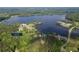 An aerial view shows the property at 48 Paschal Rd, Temple, GA near a scenic lake at 48 Paschal St, Temple, GA 30179