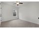 Carpeted bedroom with bright window views of the front yard and trees at 48 Paschal St, Temple, GA 30179