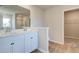 Bright bathroom with double vanity, walk-in closet, and linen closet at 5 Camellia Dr, Fairburn, GA 30213