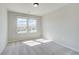 Bright bedroom with carpet, featuring two windows at 5 Camellia Dr, Fairburn, GA 30213