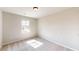 Simple bedroom with plush carpeting and a bright window at 5 Camellia Dr, Fairburn, GA 30213