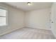 Neutral bedroom features plush carpeting and a large window at 5 Camellia Dr, Fairburn, GA 30213