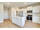Stylish kitchen featuring a center island, stainless steel appliances, and ample storage at 5 Camellia Dr, Fairburn, GA 30213