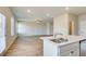 Open kitchen and living area with an island sink and stainless steel dishwasher at 5 Camellia Dr, Fairburn, GA 30213