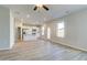 Open-concept living and kitchen area featuring hardwood floors and abundant natural light at 5 Camellia Dr, Fairburn, GA 30213