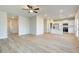 Large living area with hardwood floors connecting the kitchen and dining spaces at 5 Camellia Dr, Fairburn, GA 30213