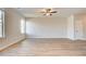 Spacious living room with wood-look flooring and a ceiling fan at 5 Camellia Dr, Fairburn, GA 30213