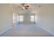 Large main bedroom features vaulted ceiling, fan, and plush carpeting at 5 Camellia Dr, Fairburn, GA 30213