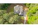 Aerial view of a beautiful home surrounded by lush greenery and a long driveway at 1206 Kincaid Rd, Marietta, GA 30066