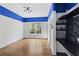 Bedroom with hardwood floors, a large window, and a custom-designed wall with a chalkboard and shelves at 1206 Kincaid Rd, Marietta, GA 30066