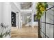 Entryway featuring hardwood floors, view of stairs and a modern light fixture at 1206 Kincaid Rd, Marietta, GA 30066
