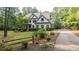 Charming two-story home with lush landscaping and a long driveway at 1206 Kincaid Rd, Marietta, GA 30066