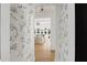 Hallway with hardwood flooring and decorative floral wall accents at 1206 Kincaid Rd, Marietta, GA 30066
