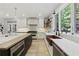 Bright kitchen featuring stainless steel appliances, a large island, and a copper farmhouse sink at 1206 Kincaid Rd, Marietta, GA 30066