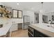 Bright and airy kitchen featuring a built-in desk, stainless steel appliances, and open shelving at 1206 Kincaid Rd, Marietta, GA 30066