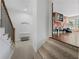 This landing has carpeted stairs and access to a playroom with hardwood floors and unique wall art at 1206 Kincaid Rd, Marietta, GA 30066