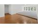 Bright living room with hardwood floors and a raised carpeted platform by a window at 1206 Kincaid Rd, Marietta, GA 30066