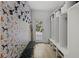 Charming mudroom with patterned wallpaper, bench seating, and storage cubbies at 1206 Kincaid Rd, Marietta, GA 30066