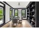 Bright office featuring hardwood floors, built-in shelving, and backyard views at 1206 Kincaid Rd, Marietta, GA 30066