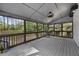 Cozy screened porch with wood flooring, screen walls, and nature views at 1206 Kincaid Rd, Marietta, GA 30066
