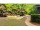 Scenic side yard features a stone walkway and outdoor seating area at 1206 Kincaid Rd, Marietta, GA 30066