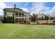 Secluded backyard with lush green lawn, fencing, and mature landscaping, creating a private outdoor oasis at 3024 Malbec Vly, Acworth, GA 30101