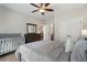 Neutral bedroom featuring a large bed, dresser, and nearby bathroom creating a serene haven at 3024 Malbec Vly, Acworth, GA 30101