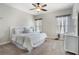 Bright bedroom featuring a large bed, dresser, and windows offering ample natural light at 3024 Malbec Vly, Acworth, GA 30101