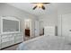 Bright bedroom featuring a large bed, dresser, and adjoining bathroom, providing a comfortable retreat at 3024 Malbec Vly, Acworth, GA 30101