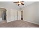 Neutral bedroom features carpet, ceiling fan, double closets, and adjoining bathroom, providing a comfortable retreat at 3024 Malbec Vly, Acworth, GA 30101