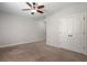 Bedroom showcasing neutral walls, carpet flooring, double door closet providing storage and style at 3024 Malbec Vly, Acworth, GA 30101
