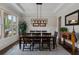 Charming dining room featuring a wooden table, stylish chairs, and ample natural light at 3024 Malbec Vly, Acworth, GA 30101