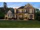 Beautiful two-story home with brick and siding exterior, manicured lawn, and inviting front porch, creating curb appeal at 3024 Malbec Vly, Acworth, GA 30101