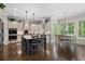 Open kitchen with an island, stainless steel appliances, white cabinets, hardwood floors and a breakfast nook at 3024 Malbec Vly, Acworth, GA 30101