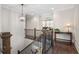 The landing features hardwood floors, natural light, and iron railings at 3024 Malbec Vly, Acworth, GA 30101