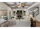 Cozy living room with fireplace, built-in shelves, and a staircase leading to the second floor at 3024 Malbec Vly, Acworth, GA 30101