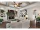 Well-lit living room featuring a fireplace, built-in shelving, and staircase, perfect for relaxation and entertaining at 3024 Malbec Vly, Acworth, GA 30101