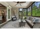 Bright sunroom features large windows, comfortable seating, and an elegant rug at 3024 Malbec Vly, Acworth, GA 30101