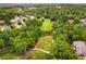An aerial view of a Golf Course with lush green fairways at 580 Grimsby Ct, Suwanee, GA 30024