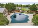 Aerial view of community amenities including a pool, slide, and well-maintained landscaping at 580 Grimsby Ct, Suwanee, GA 30024