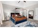 A stylish primary bedroom features a canopy bed, neutral walls, and a view reflected in the mirror at 580 Grimsby Ct, Suwanee, GA 30024