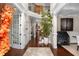 Elegant foyer with soaring ceilings, hardwood floors, staircase, and sophisticated decor at 580 Grimsby Ct, Suwanee, GA 30024