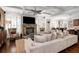 Spacious living room featuring a fireplace, plush seating, and an open layout at 580 Grimsby Ct, Suwanee, GA 30024