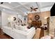 Comfortable living room featuring a fireplace, stylish furnishings, and abundant natural light at 580 Grimsby Ct, Suwanee, GA 30024