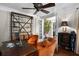 Cozy office with stylish decor, a large desk, seating area, and a view into the home at 580 Grimsby Ct, Suwanee, GA 30024