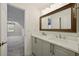 Bright bathroom boasts double vanity with white marble countertop and decorative patterned tile flooring at 6355 Glen Oaks Ln, Atlanta, GA 30328